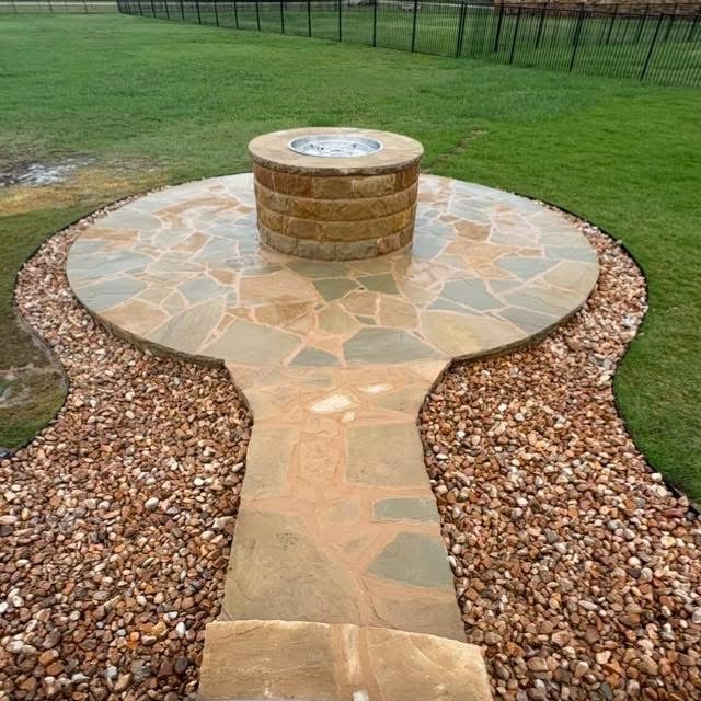 Stone fire pit on flagstone patio