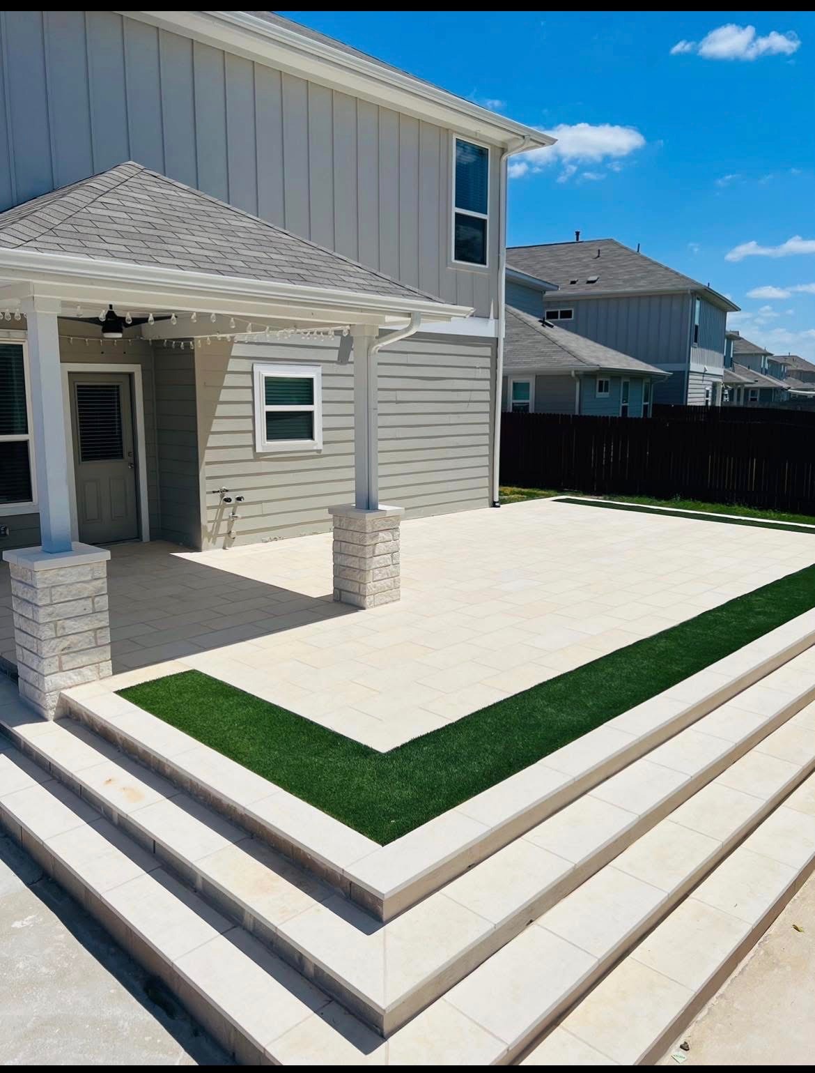 Finished paver patio with turf inlay and steps, Austin TX